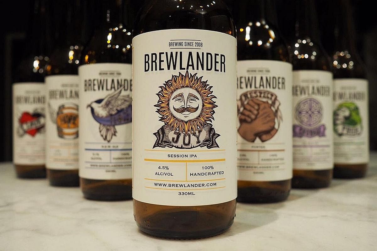 For those who like their beers hoppy, Joy (left) is a session Indian pale ale with 4.5 per cent alcohol. Brewlander & Co's (below from left) Allan Wu, Daniel Ong and John Wei.