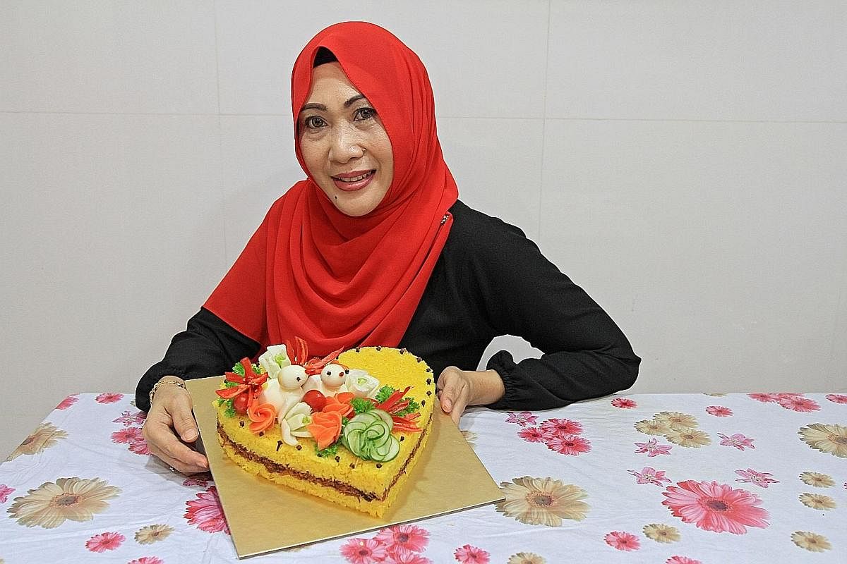 The pulut kuning cake by Madam Julia Sallim has "birds" made from eggs and vegetable "flowers".