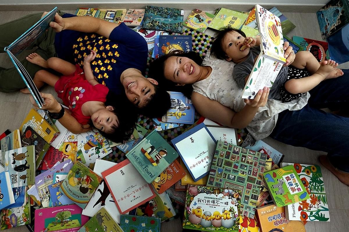 Mrs Tiffany Lim with her husband, Paul, 30, and children Chloe, three, and Joash, one. She has been buying books for her kids online in the past year. Mrs Melissa Lee with her husband Lee Chien Herr, 36, and their children Ryan, three, and Renee, one