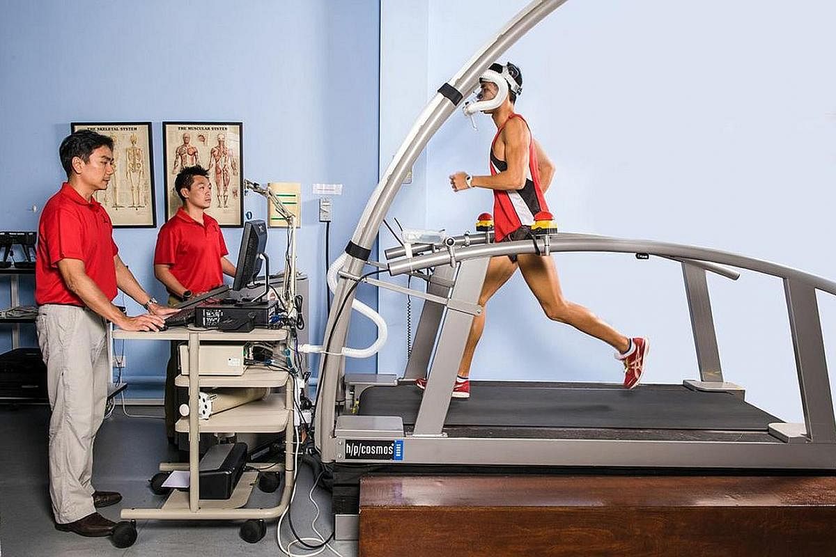 A runner undergoing a laboratory test to monitor maximum oxygen uptake (VO2max) on a treadmill at Sport Singapore.