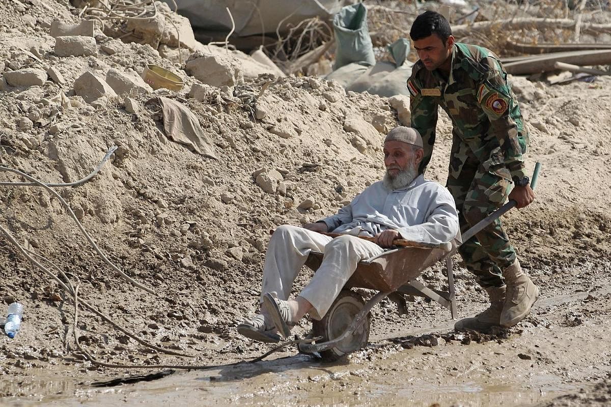 From the very young to the elderly, residents of the Old City in Mosul getting help last Friday from members of the Iraqi Special Forces to flee the area ahead of the offensive to retake the city from ISIS fighters.