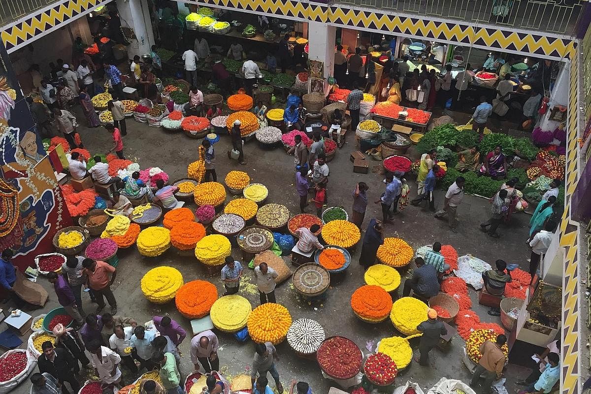 The world-famous Taj Mahal is an homage to love. The somewhat curious Bangalore Palace features Tudor architecture. The Krishna Rajendra flower market in Bangalore is a riot of colours. Vadai (top) and masala thosai (bottom left) served with tiny tub