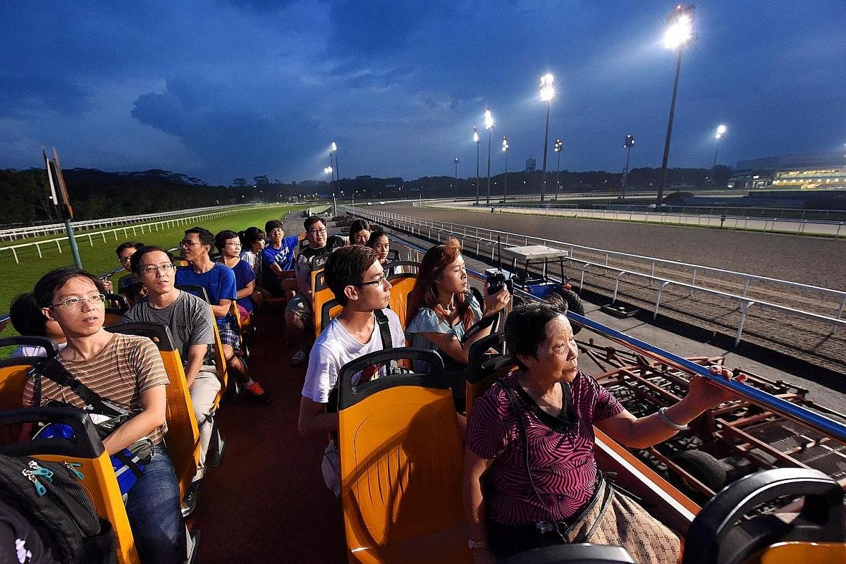 Members of the public looking at the different types of tracks used for horse racing - such as grass turf and synthetic Polytrack - at STC's carnival on June 10. The bus tour also took visitors past the stables. STC says the annual carnival is a good