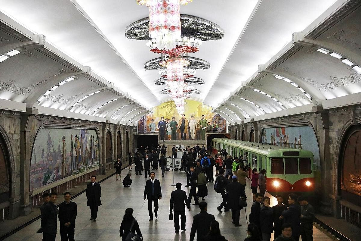 A rare peek into the infrastructure in North Korea as a subway train arrives in an underground station in the capital city.