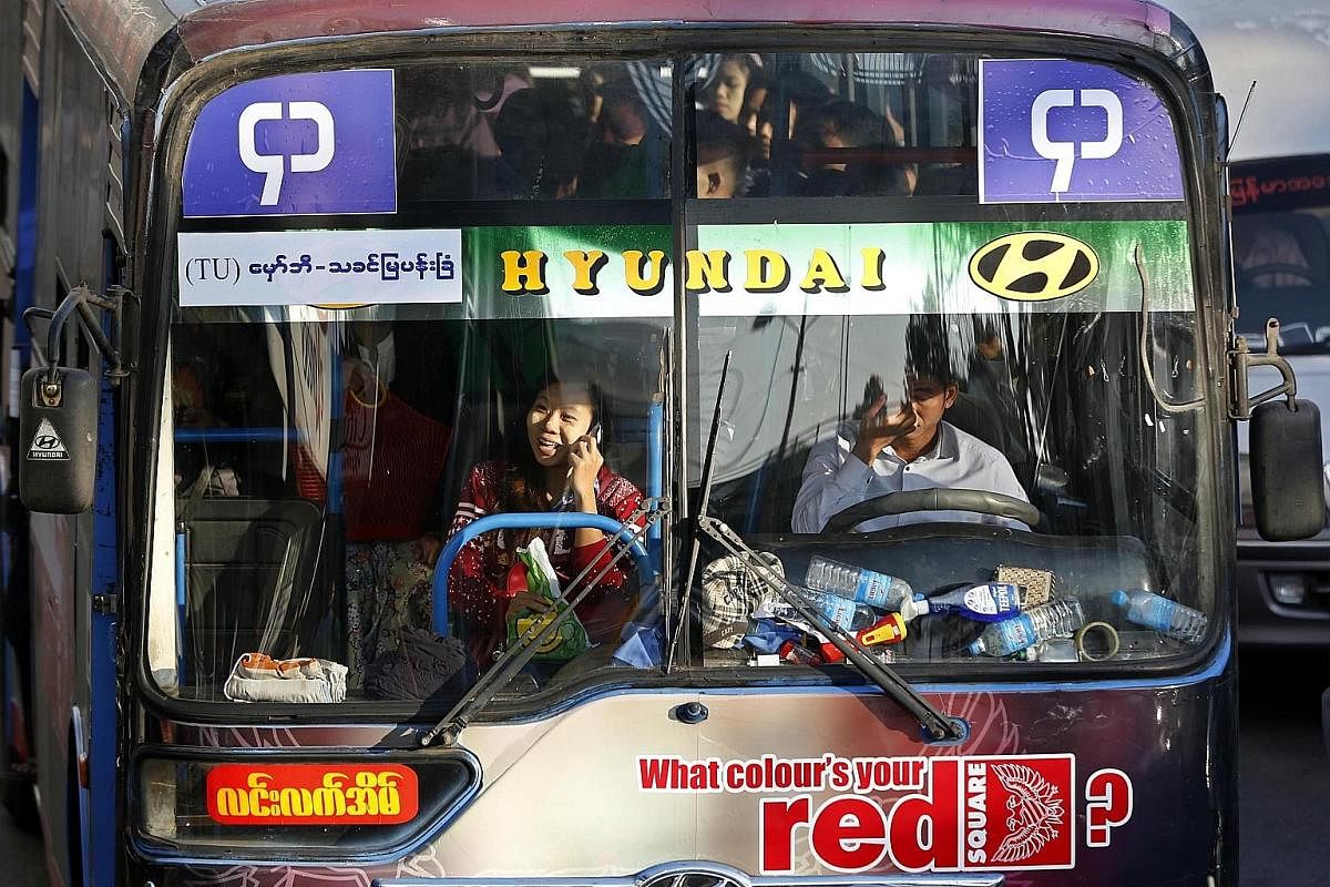 A crowded bus during rush hour in Yangon, Myanmar, in January. A revamp of the bus system that month saw the number of bus routes slashed, drawing public criticism.