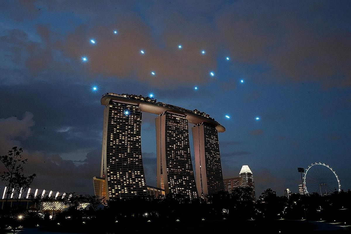 An illustration of the seven drone formations (left) at this year's National Day Parade. Images are for illustration only and may differ during actual performance. A multi-drone display as part of the exhibition titled The Future Of Us at Gardens by 