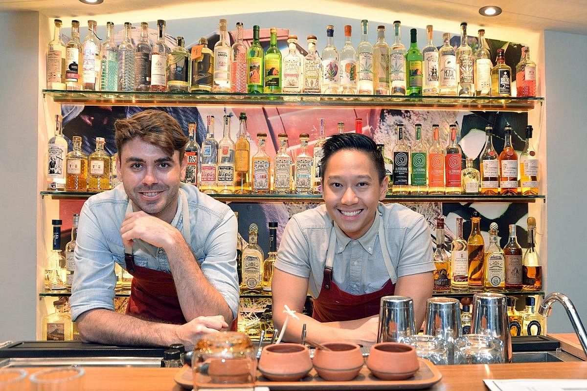Junior's head bartenders Zachary De Git (left) and Peter Chua have more than 100 bottles of tequila, mezcal and other Mexican spirits by independent and craft producers on offer.
