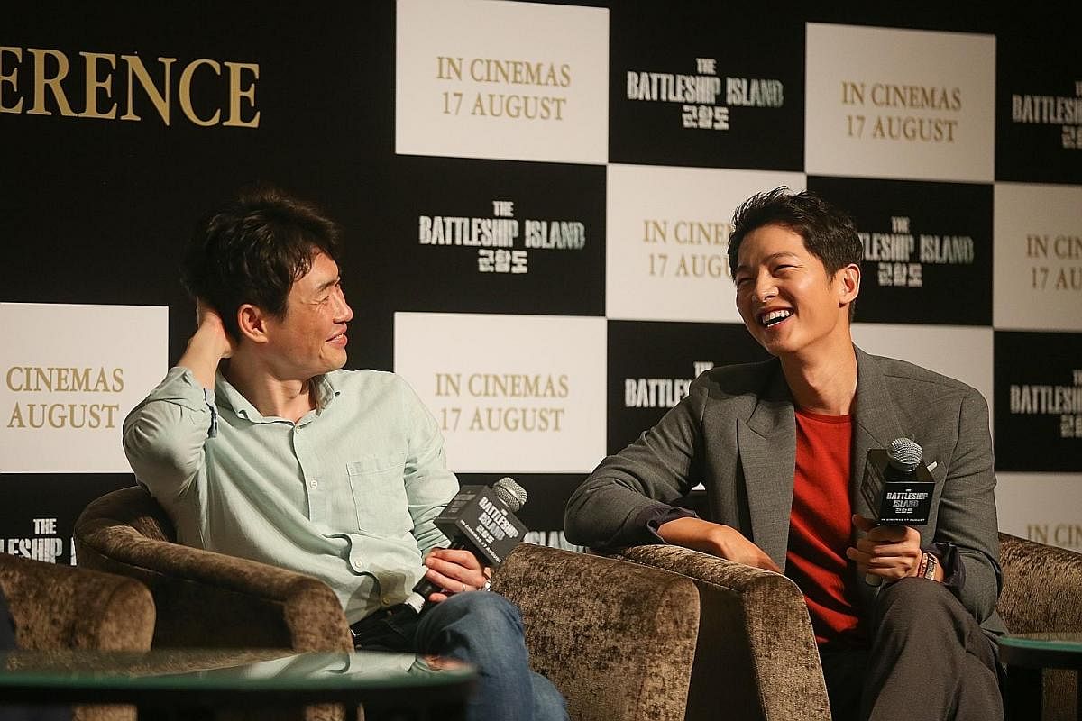 South Korean actor Song Joong Ki (left) with Ryoo Seung Wan, director of his latest film, The Battleship Island, at a press conference at Marina Bay Sands yesterday.