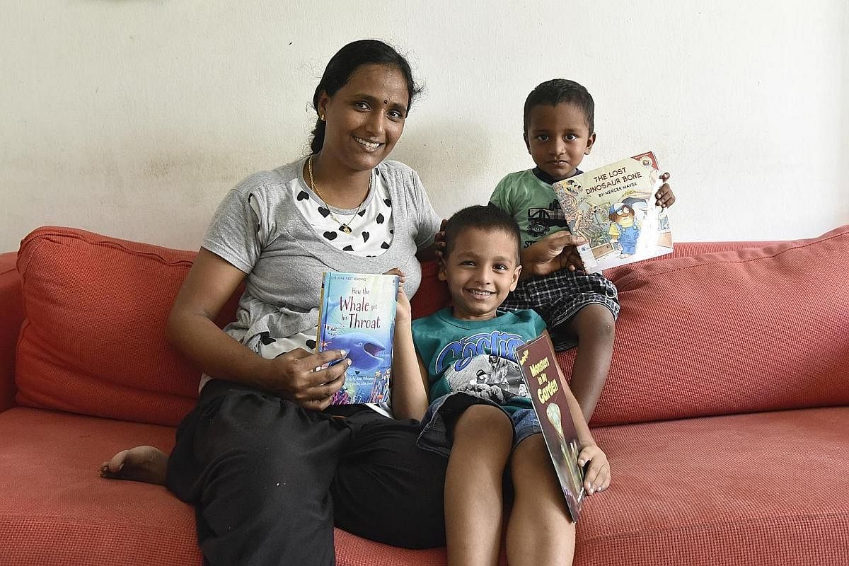 Housewife Shanmugam Rekha uses diverse ways, such as attending story-telling at libraries, to teach her sons Rakshith, six, and Jai Rakshan, two, to read.