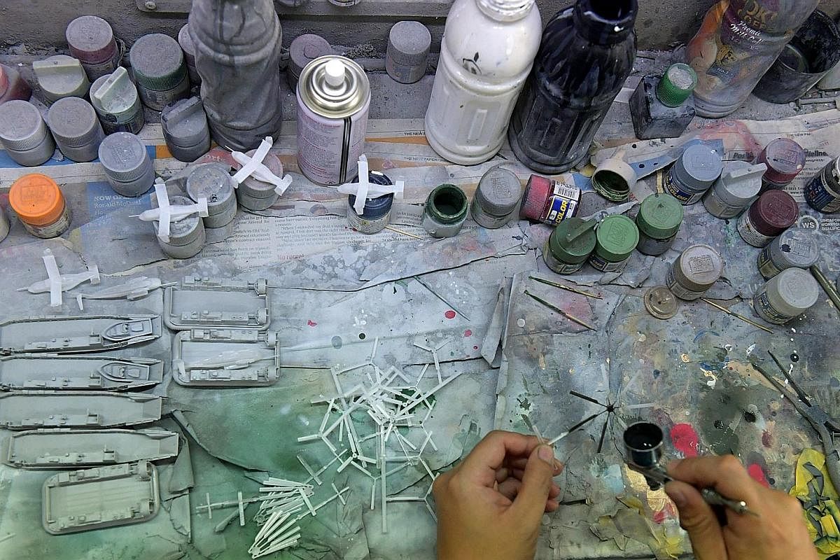 Mr Calvin Tan, 41, is not only a World War II buff but also a world-renowned miniature figure sculptor and painter. The winner of many overseas awards is also an author and recently produced a videoon the art of miniature figure painting. It can take