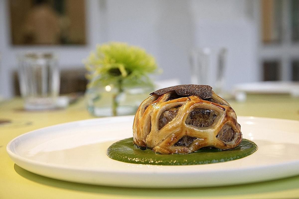 Como Cuisine's Wellington is unlike traditional Beef Wellington as the meat is enveloped in a pastry net instead. There is also a slice of pan-fried foie gras under the beef and the Wellington is topped with shavings of black truffle.