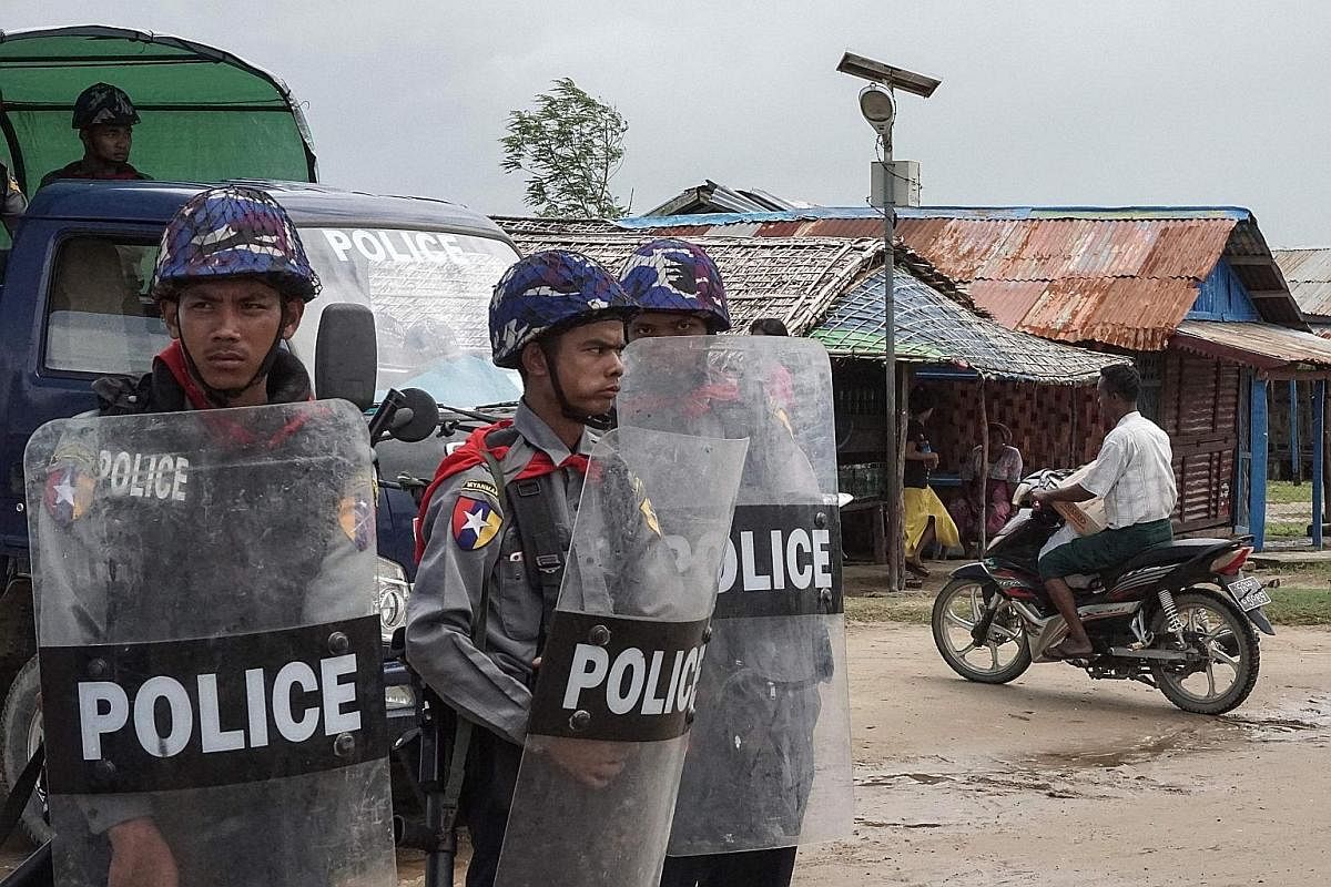 Myanmar police at an Internally Displaced Persons camp in Sittwe, Rakhine, last Friday. UN chief Antonio Guterres has urged security forces to show restraint after hundreds were reported killed in communal violence.
