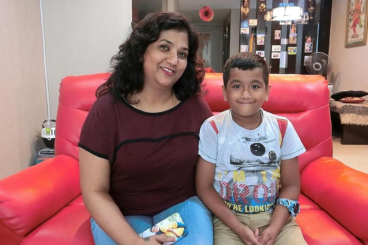 Ms Mary Rajini sent her son Jordan Justin (both above), eight, for a handwriting improvement class and says his handwriting (left) has improved by "90 per cent".