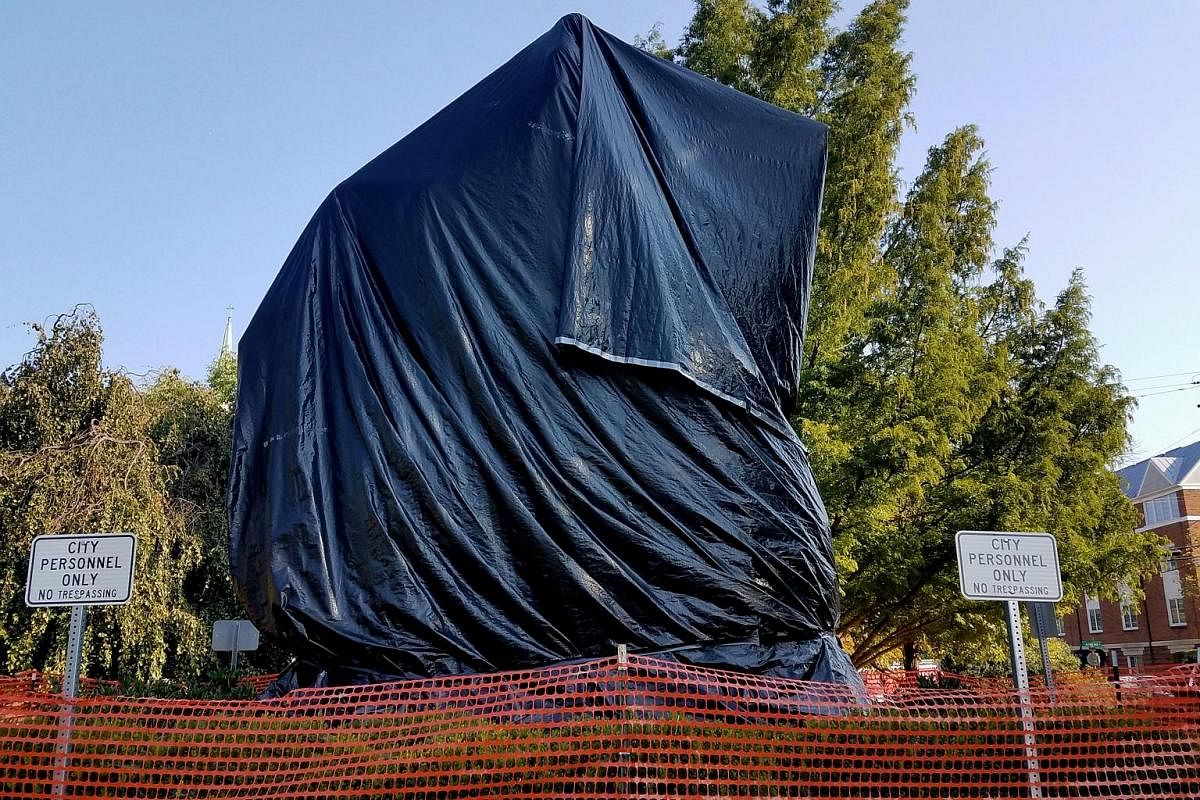 The statue of Confederate General Robert E. Lee, at the centre of the Aug 12 events and an offensive reminder of oppression to many, is now shrouded in black tarpaulin.