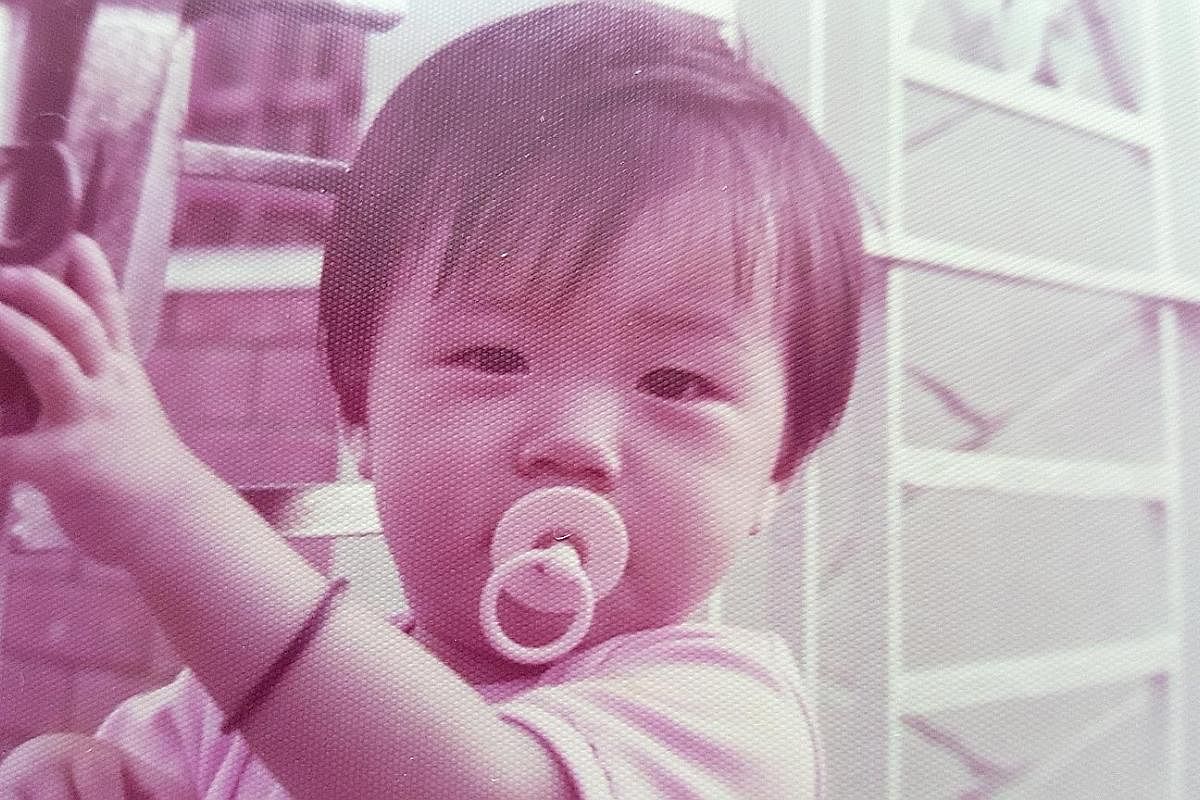 Ms Cheryl Gan as a toddler (above) in an undated photograph.