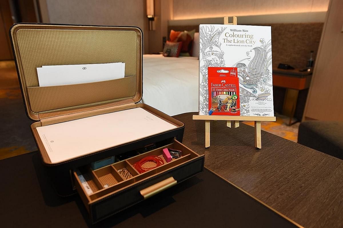 (Right) Each guestroom has a colouring set, including a Colouring The Lion City: A Sophisticated Activity Book For Adults, with whimsical illustrations of Singapore. (Right and far right) Small wood barrels containing barrel-aged cocktails are stacke