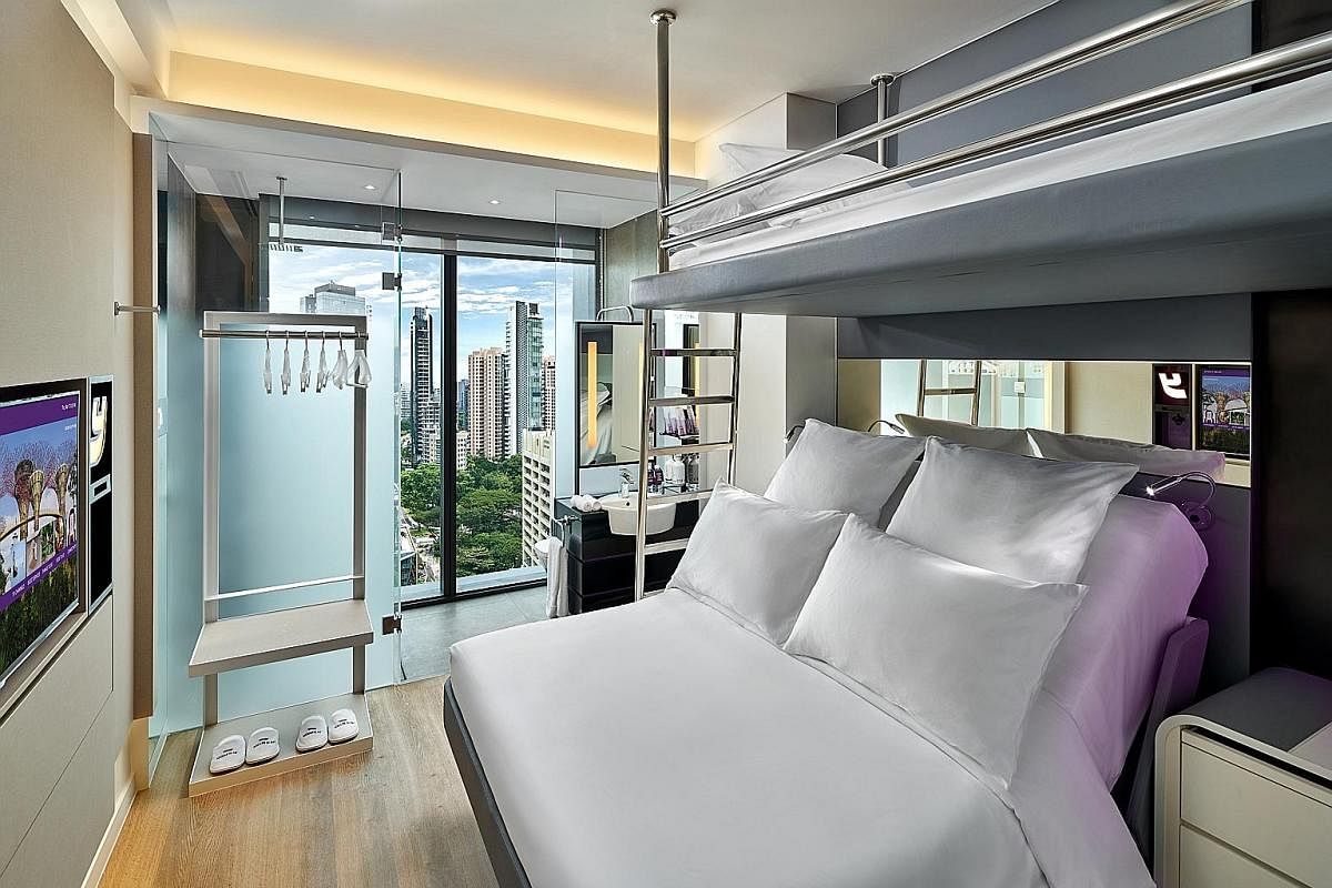 Yotel Singapore uses housekeeping robots to make deliveries. The hotel's restaurant, Grains & Hops (above), and a Premium Queen room with a bunk (below).