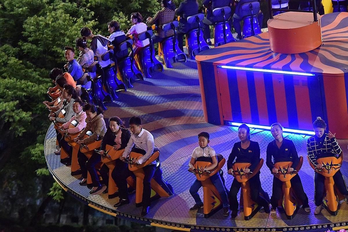 Thrill seekers at Kaeson Youth Amusement Park, where Mr Kim Jong Un is said to have tested all the rides. The park is one of the few avenues for Pyongyang's residents to get a dose of fun. Children performing for visitors at Kyongsang Kindergarten. M