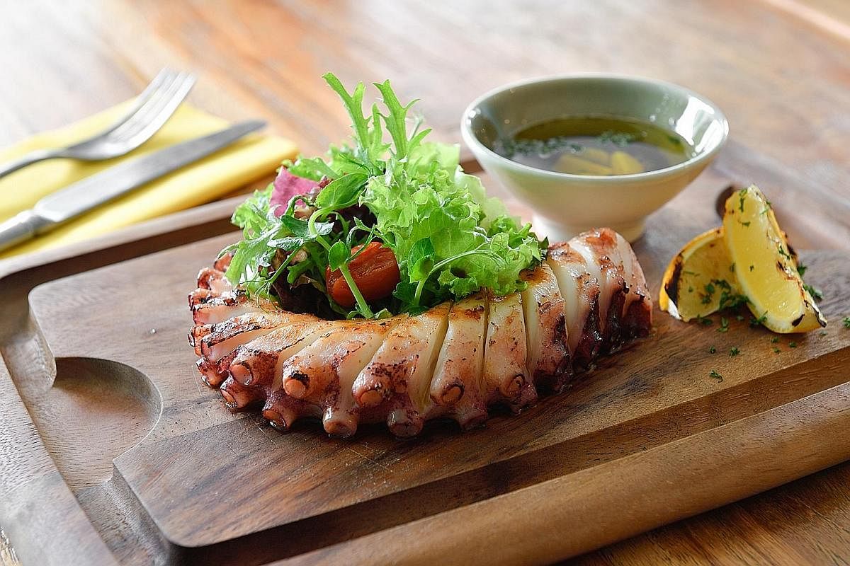 The restaurant's Grilled Meat Platter (above) and Grilled Atlantic Octopus Leg With Herbs (below).