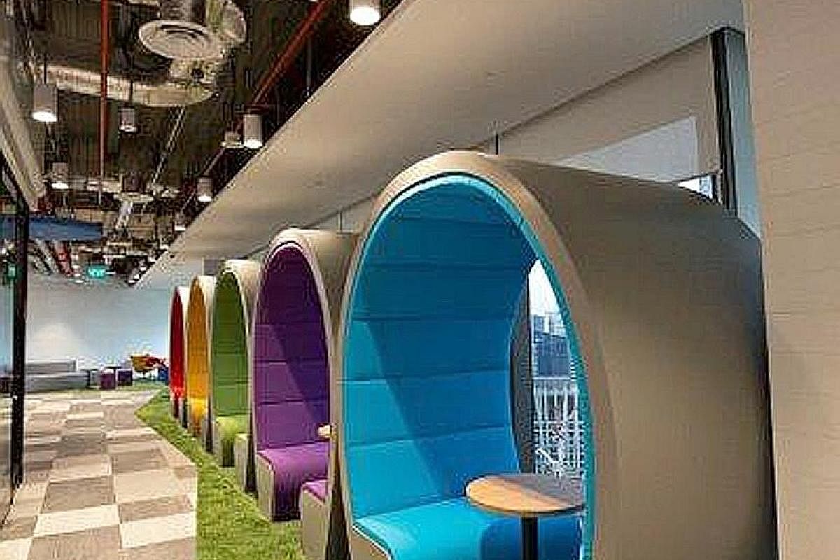 The iconic Old Hill Street Police Station building (above), a Singapore landmark, is depicted in a meeting room. Seating areas in Agoda's Singapore office get a splash of colour with red, yellow, green, purple and blue accents - the hues in the compa