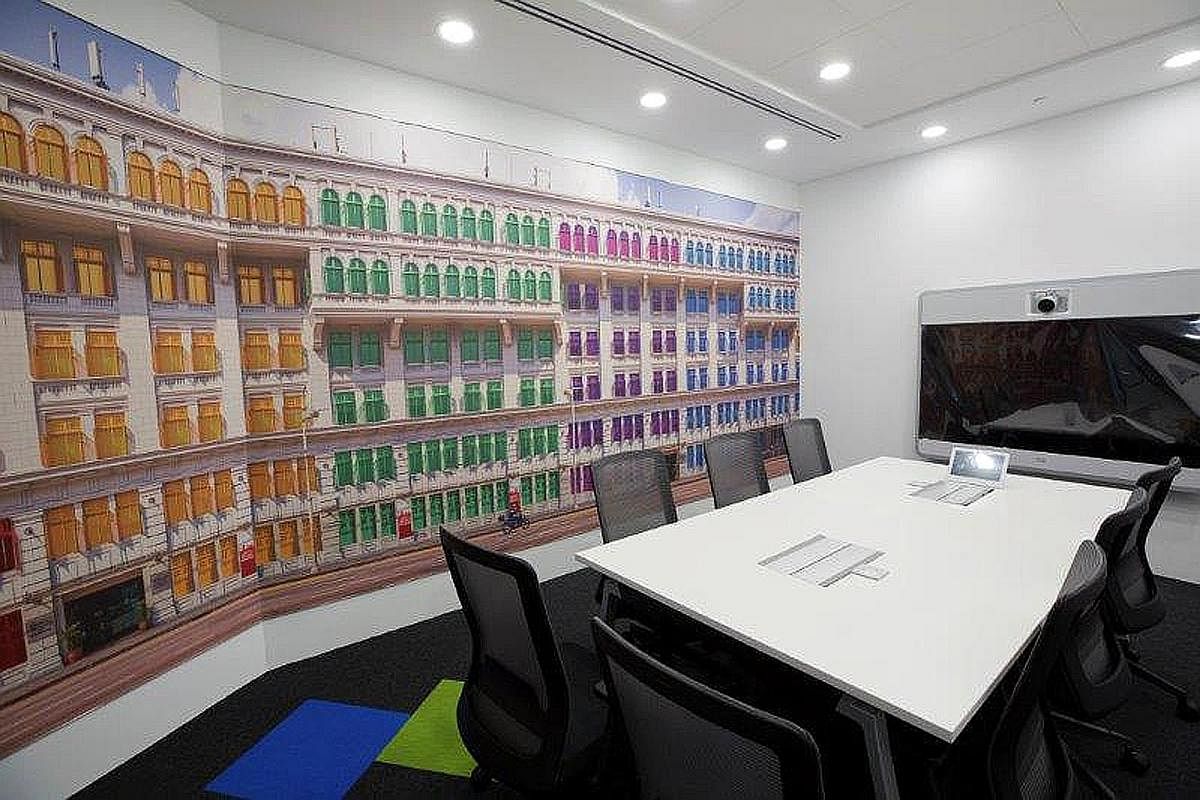 The iconic Old Hill Street Police Station building (above), a Singapore landmark, is depicted in a meeting room. Seating areas in Agoda's Singapore office get a splash of colour with red, yellow, green, purple and blue accents - the hues in the compa