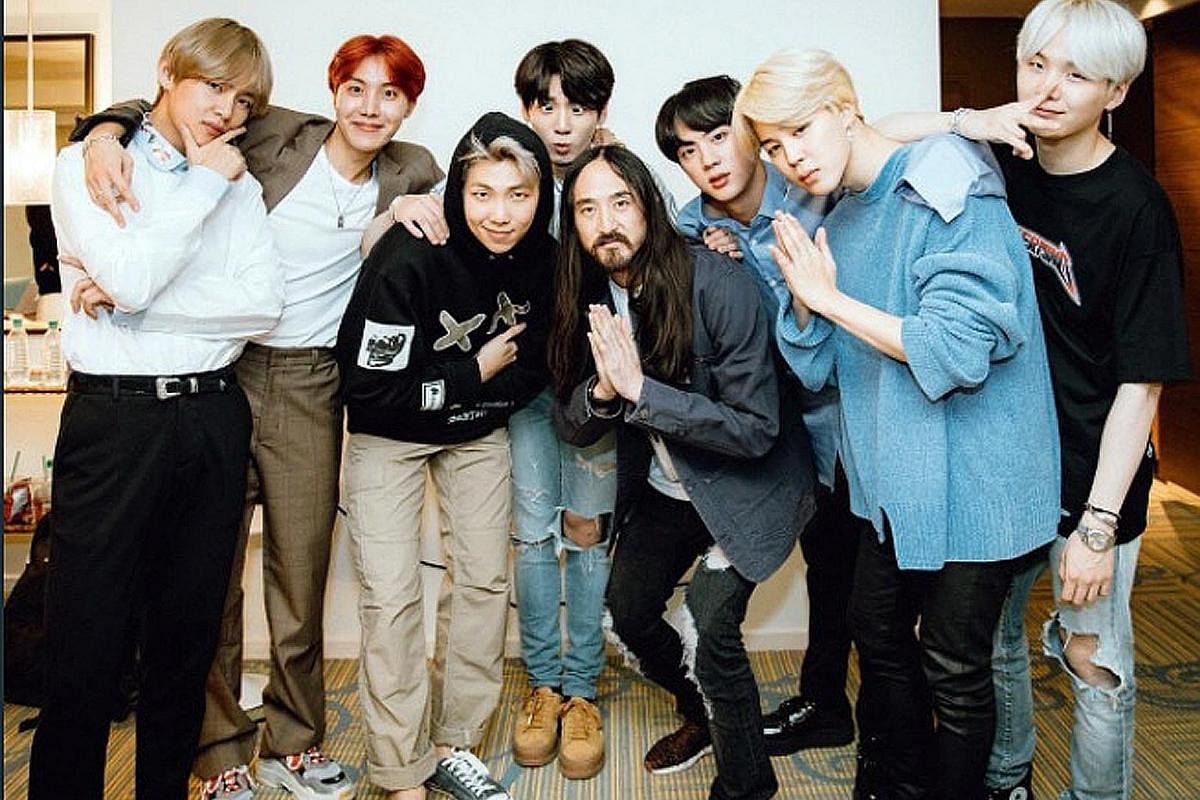 BTS with DJ Steve Aoki (fifth from left).