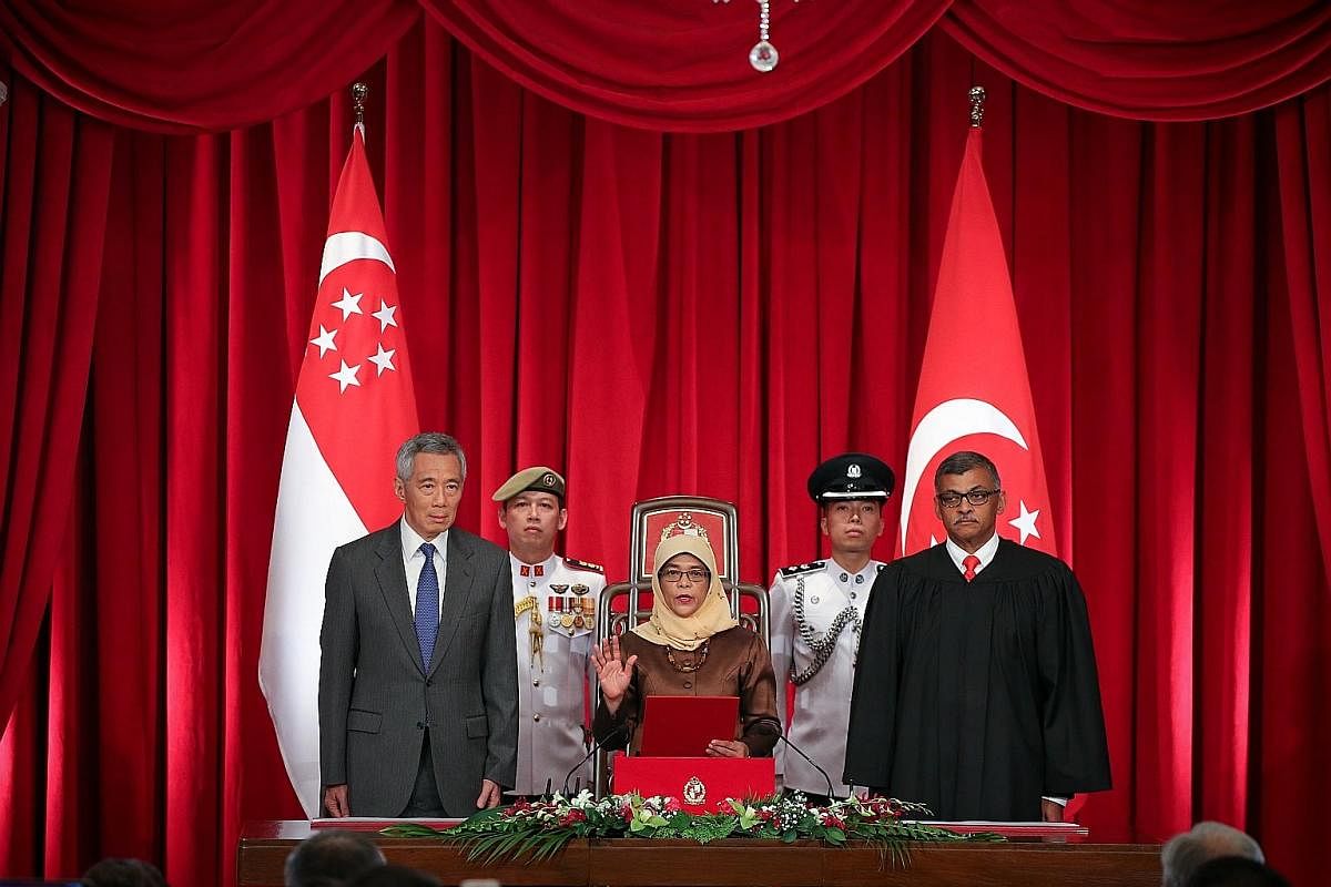 SEPT 14: Madam Halimah Yacob, flanked by Prime Minister Lee Hsien Loong and Chief Justice Sundaresh Menon, being sworn in at the Istana as Singapore's eighth president and the country's first woman president. Madam Halimah, 63, is the former Speaker 