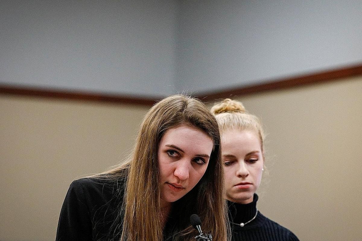 Former gymnast Lyndsy Carr (left) embracing her mother in court. Ms Carr was allegedly molested when she was 11 or 12 years old.
