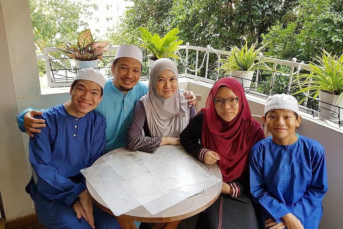 Mr Mohammad Ali Dawood and his wife, Ms Faraliza Zainal, with their children (from left) Mohammad Ashraf, Nur Aliah and Mohammad Adam.