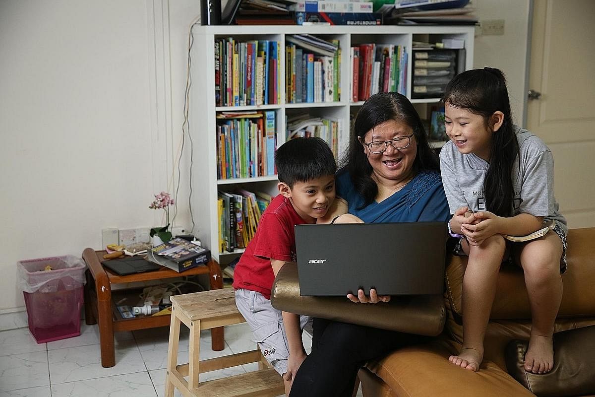 Scientist Seng Tzer Jing supervises the Internet use of her children, son Kam Hao Re, 10, and daughter Kam Xi Yu, eight, and encourages them to use dictionaries and encyclopaedias to verify information. Lawyers Claire and Boaz Nazar have trained thei