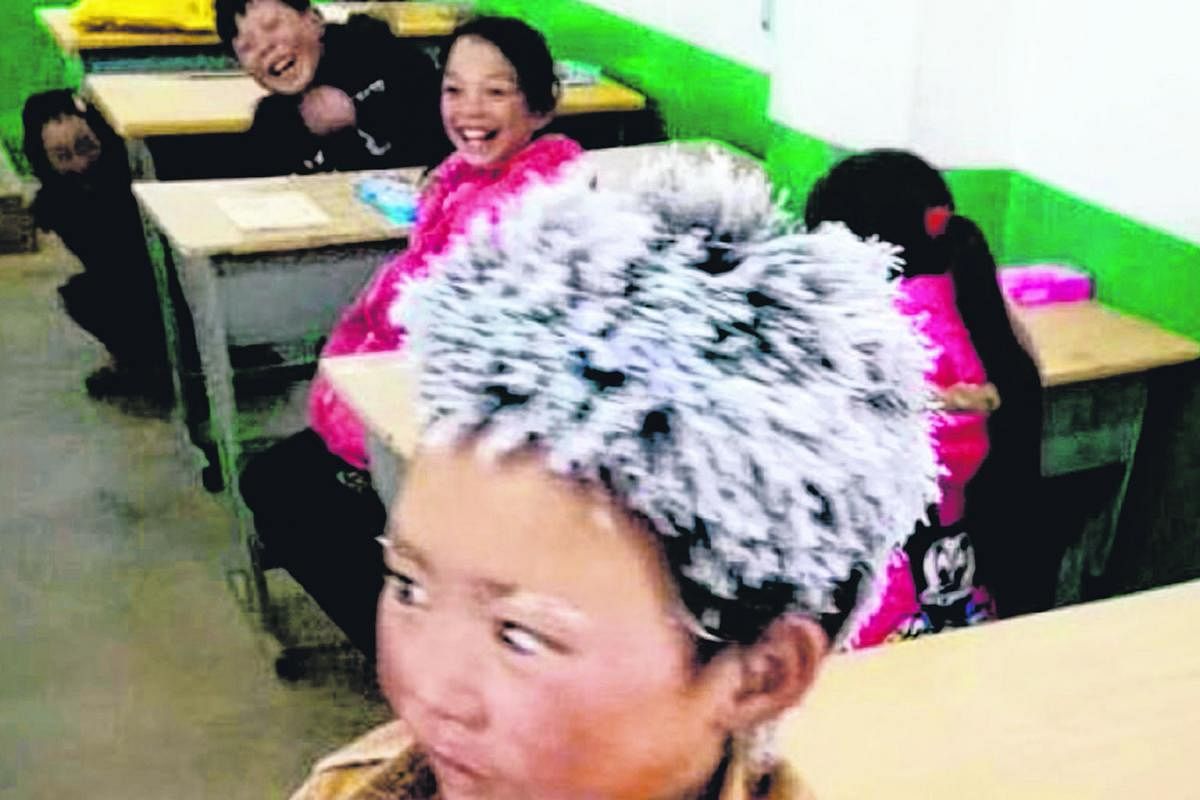 The case of "Snowflake Boy" Wang Fuman, whose story went viral in China - and worldwide - last month, focused attention on the plight of China's 61 million "left-behind" children, whose parents work in faraway cities. A couple with their daughter in 