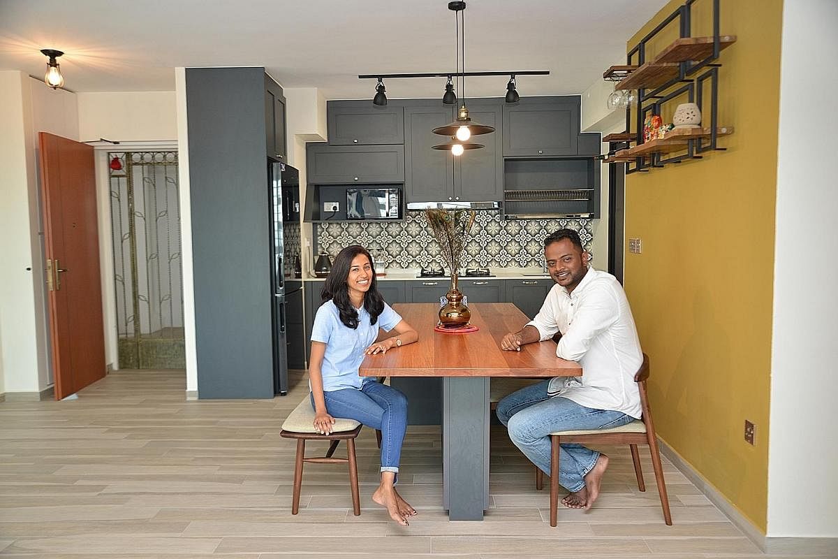 A 2.4m-long wooden table big enough for 12 helps seat guests comfortably when home owners Vijaya Krishnan and Viknesh Barathan (both above) entertain.