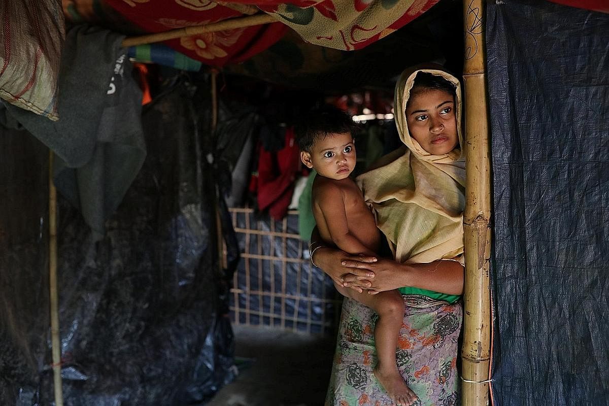Madam Rehana Khatun's husband Nur Mohammed was among the 10 men killed by Myanmar security forces and Buddhist villagers on Sept 2 last year. She has sought refuge with her child at Kutupalong camp in Cox's Bazar
