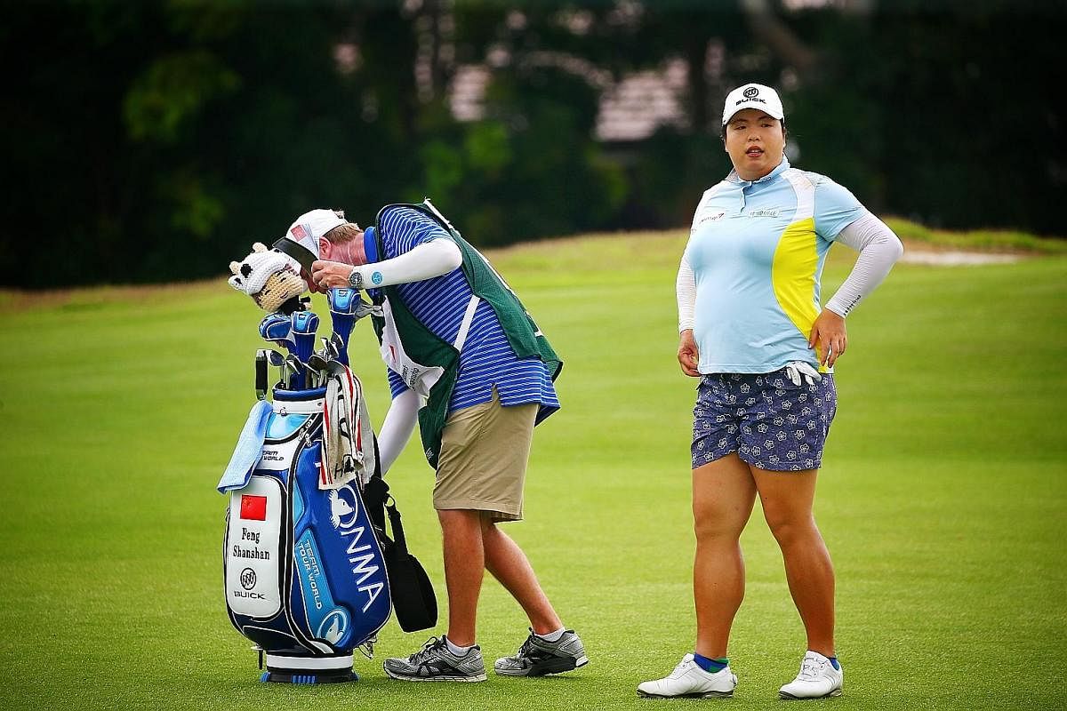 World No. 1 Feng Shanshan preparing for her round on the 13th fairway on Day 2 of the HSBC Women's World Championship yesterday. The Chinese is currently tied for 15th ahead of the third round.