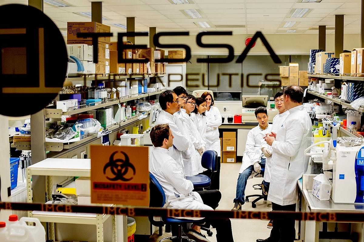 Singapore-based Tessa Therapeutics' research team gathering for a discussion at the joint immuno-oncology laboratory in A*Star's Institute of Molecular and Cell Biology. Invitrocue's team includes scientific development director of the cell-based uni