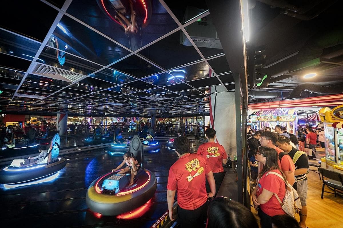 At Timezone's new flagship arcade at VivoCity, visitors can ride in a revamped bumper car arena.
