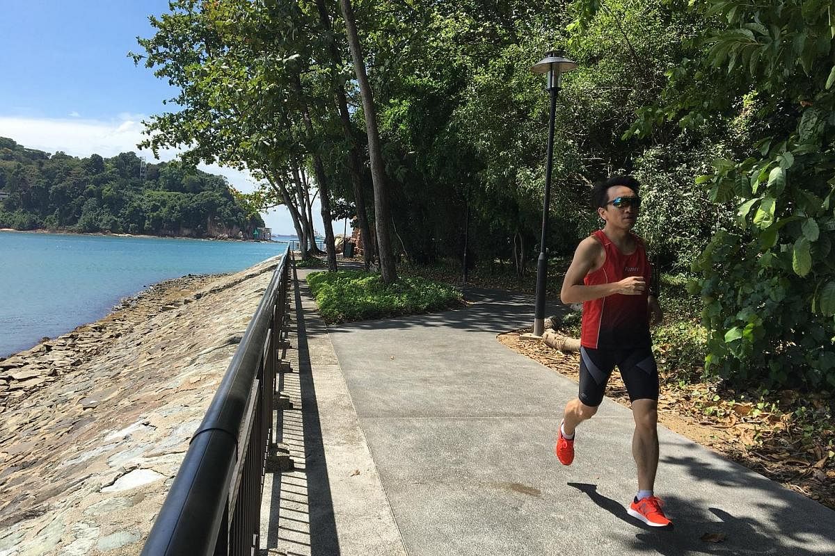 Mr Vincent Lim on his favourite route in Labrador Park, for a virtual run organised by local start-up 42Race. Home-grown start-up 42Race - which includes co-founders Augustine Chua (back row, seventh from right) and Zhou Mi (front row, second from ri