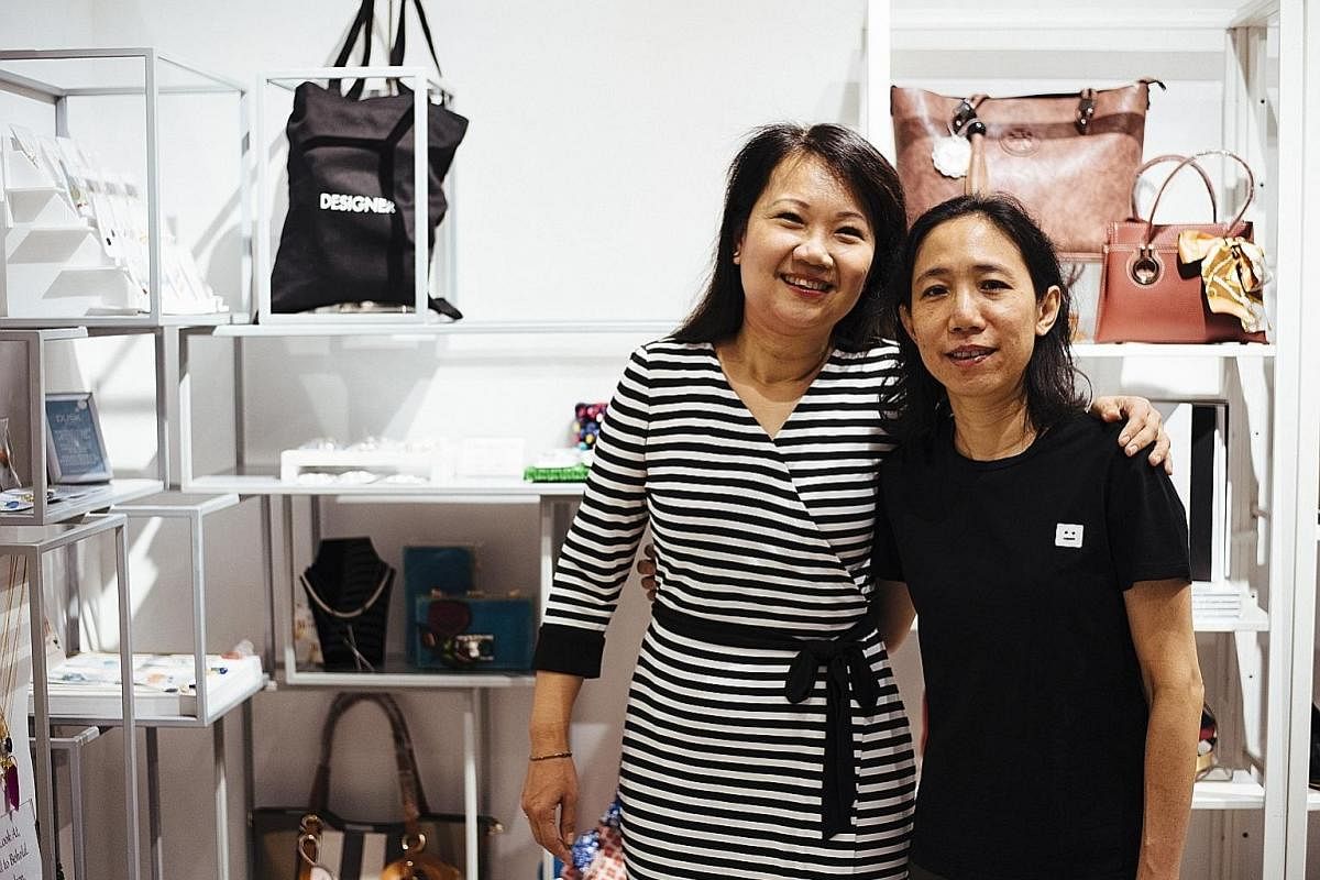Ms Elsie Szto (far left) and Ms Pearlyn Liew of contemporary womenswear shop Butterflies & Marigolds have two outlets in the Central Business District as they target women working in the area.