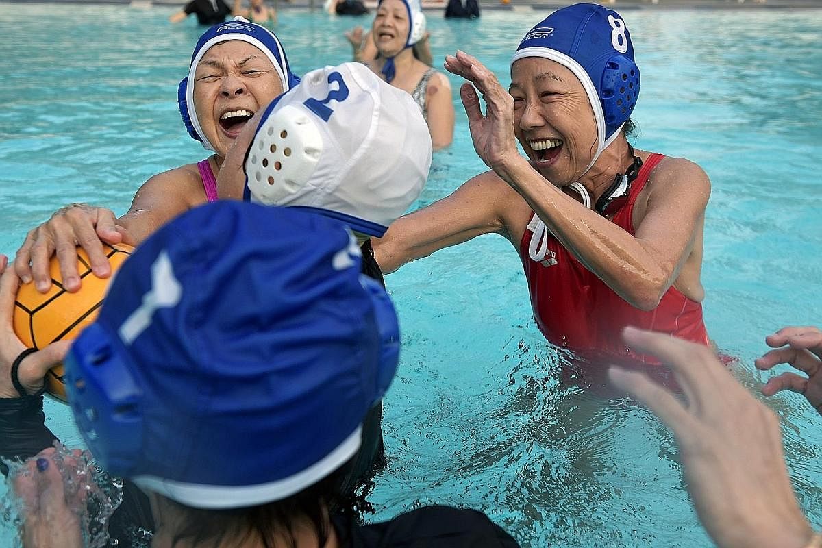 Top: Lifeguard Teo Chin Lor, 49, helping the Ah Mas to store away the water polo balls. "I've heard that some of them call me 'auntie killer', but I'm not sure who gave me that name," he said. Left: Madam Chua Li Cheng, pretending to feed Mr Gan, the