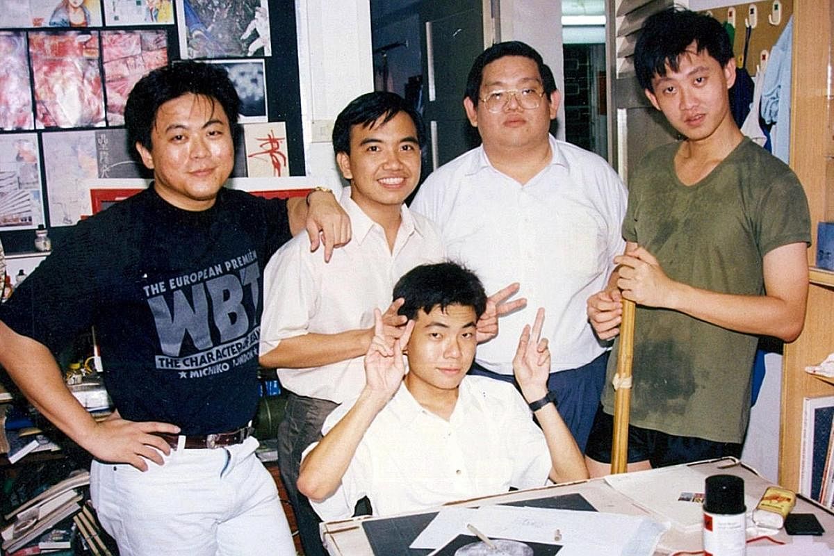 Comic artist Wee Tian Beng (left) with legendary Chinese writer Louis Cha, or Jin Yong, whose Return Of The Condor Heroes he illustrated in the late 1990s, at Cha's house. Wee (right), in his 20s, with his fellow aspiring comic artists (from left) Ta