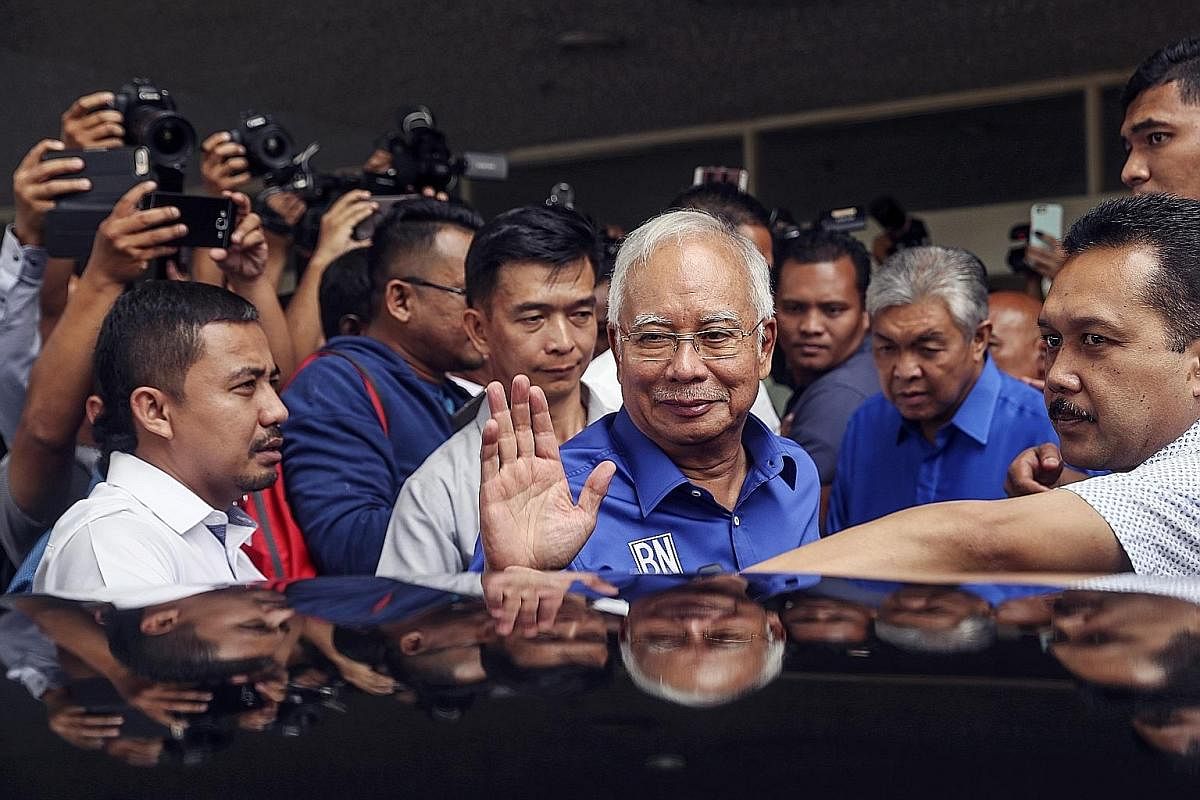 MAY 10: Mr Najib's first public appearance after the election, at the Barisan Nasional coalition headquarters. He said he accepted the people's verdict but added that no single party had won a simple majority and the King would determine who the next