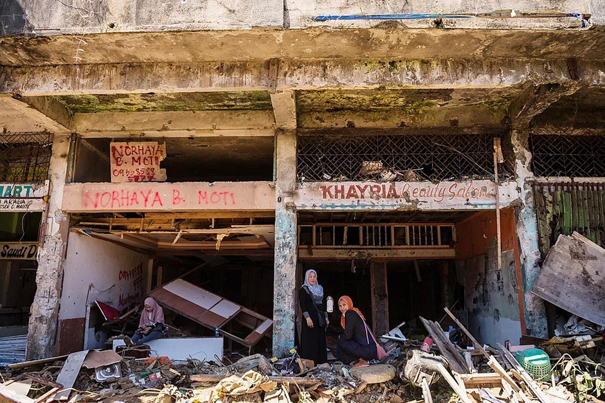 An arch marking the entrance to Marawi, which is about a tenth the size of Singapore. In May last year, about 1,000 militants claimed the city for a "caliphate" spanning thousands of kilometres. Since mid-April, residents have been allowed to return 