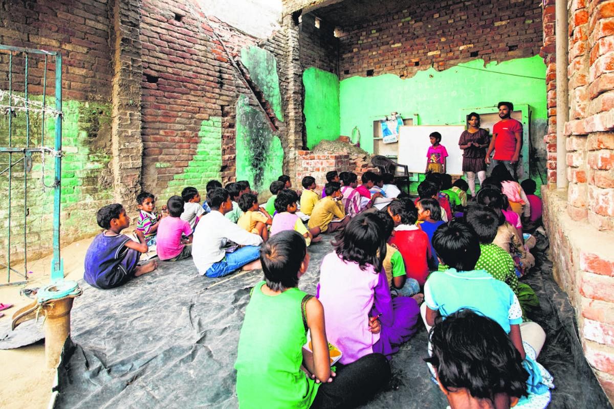 Left: Dalit children at a Bhim school, set up by Dalit rights organisation Bhim Army, in the village of Ratanpur Kalyanpur, in Uttar Pradesh. The Bhim Army has set up over 300 Bhim schools for Dalit students in Saharanpur, in Uttar Pradesh. They supp