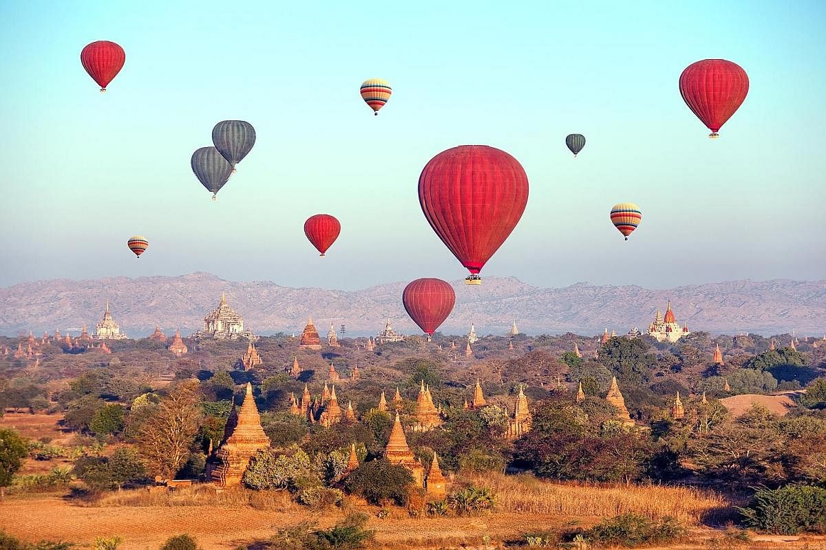 Hot-air balloons over Buddhist temples in Myanmar's Bagan. Such tours are also offered to tourists at Inle Lake, but wildlife officials prefer to scrap them, as the hot-air balloons affect the migratory birds there. More tourists are flocking to Myan