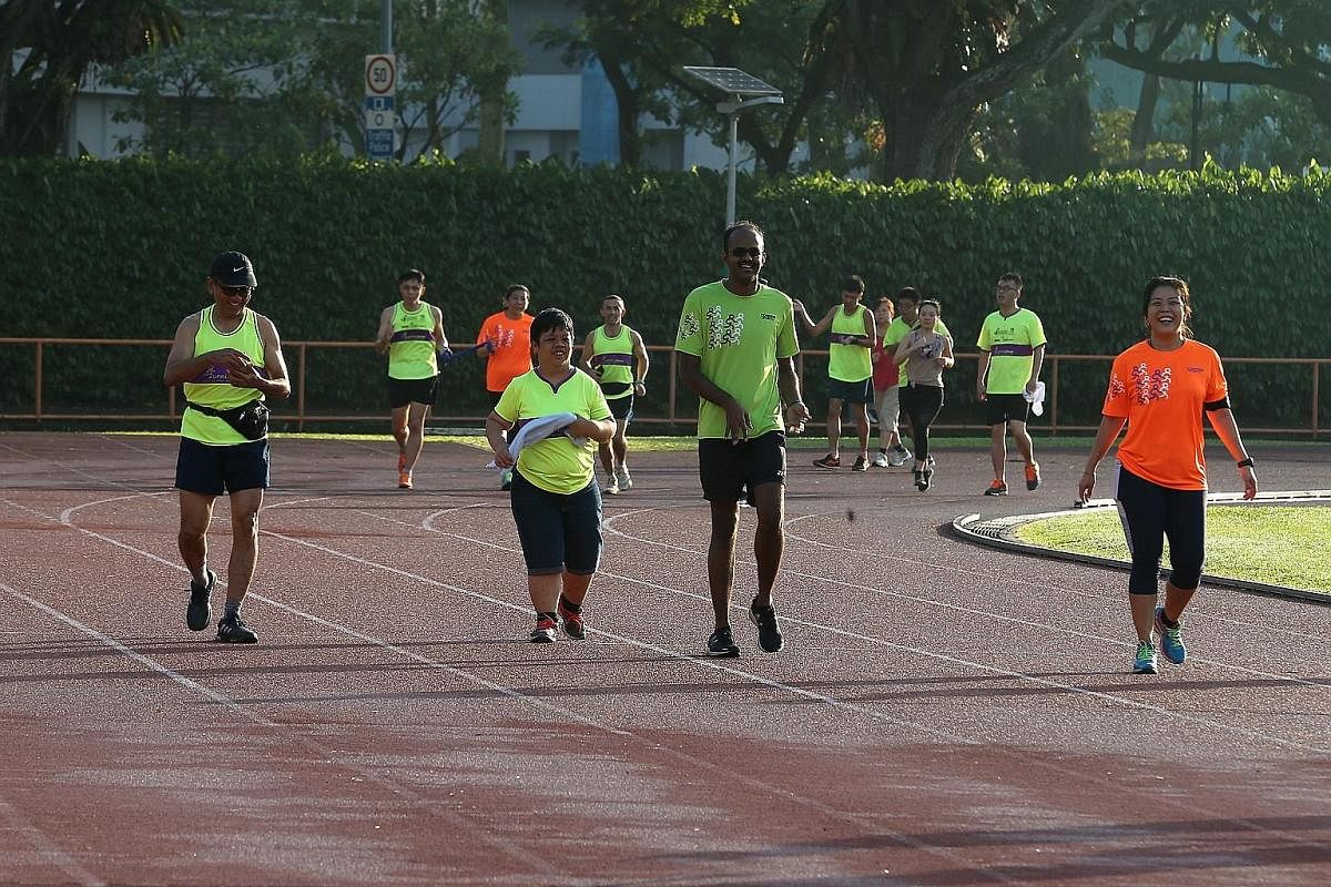 Living up to Runninghour's motto of "Run to bond, run so others can!", polytechnic lecturer and running guide Wang Cuiling and visually-impaired office worker Fadiah Aman have been doing just that together for the third time. Here they are seen compl