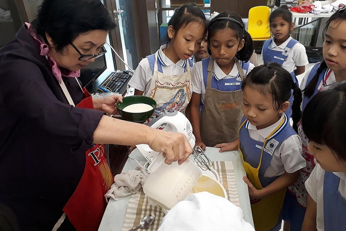 Children at a baking class at Canossaville Children and Community Services, which has received more than $7,000 in donations as a partner with Gift-It-Forward.