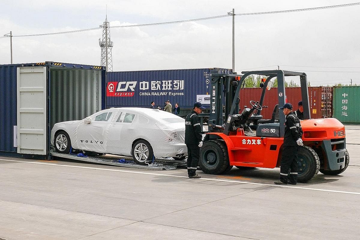 A Volvo S90 sedan being loaded into a container bound for Europe. The Swedish car maker has a plant in Daqing, Heilongjiang province. On May 21, the first China-Europe logistics train that originated from Hamburg, Germany, arrived at the Xi'an Railwa