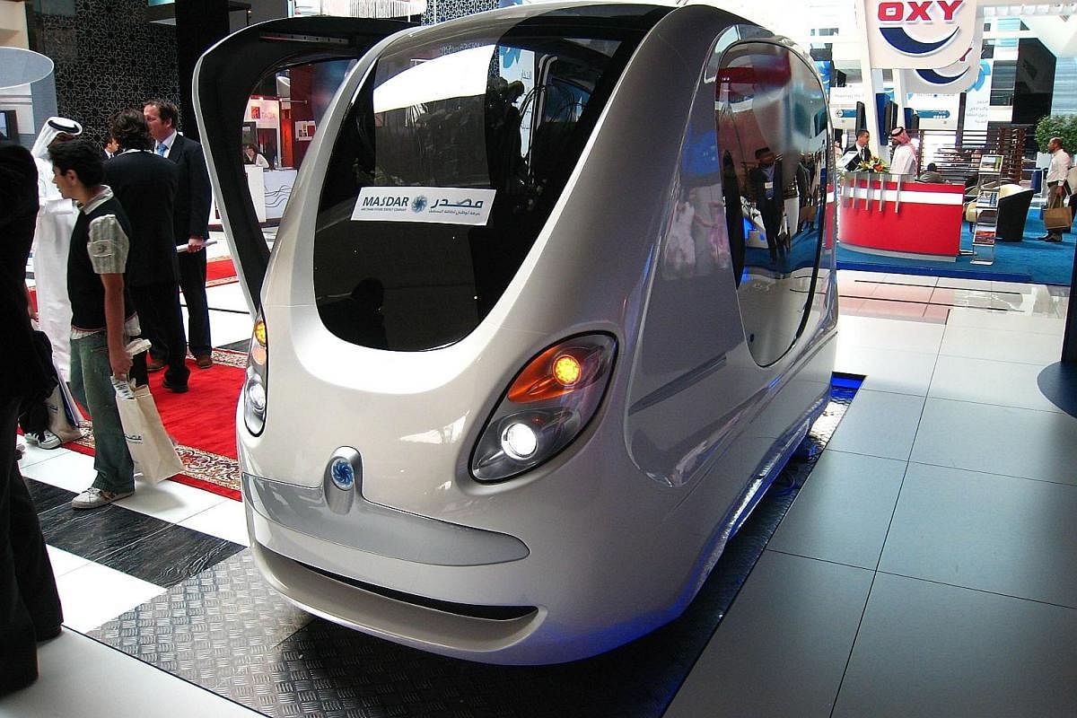 A model of the planned new capital for Egypt displayed for investors at the opening of the Egypt Economic Development Conference in 2015. A small capsule-shaped pod with no wheels and no driver, which runs along light rail lines, in Masdar City. Saud