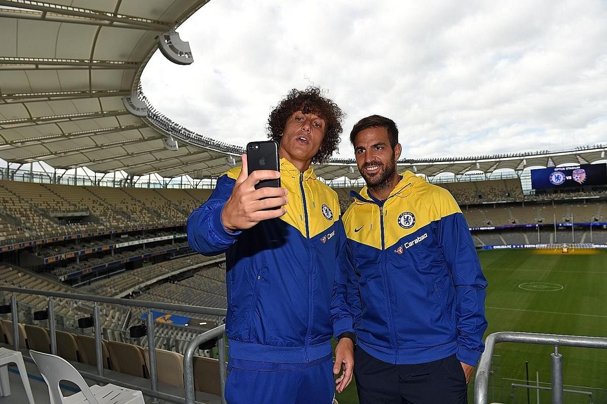 Chelsea's David Luiz (left) and Cesc Fabregas take a wefie at Perth Glory's Optus Stadium before their friendly against the A-League side on July 23. The two stalwarts of the Blues' last title-winning side in the 2016-17 season will start the campaign und