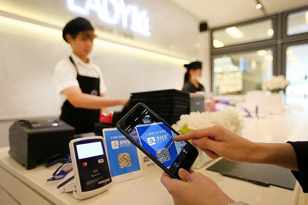 Cake cafe Lady M, whose outlets at South Beach and Scotts Square are cashless, has seen shorter billing and waiting times for customers, among other benefits, after accepting only non-cash payment methods like Alipay.